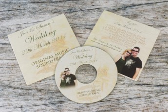 Standard wedding CDs with silver bases in 2 page CD wallets