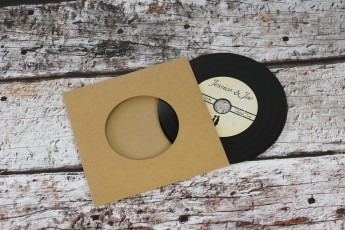 Wedding invite CDs in brown Manila recycled record-style wallets with black vinyl discs