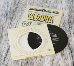Wedding invite CDs in record-style wallets with black vinyl discs