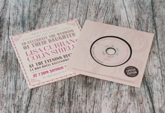 Wedding invite CDs in record-style wallets with black vinyl discs