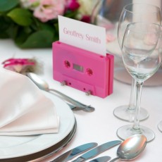 Hot pink cassette name place holder on a wedding table